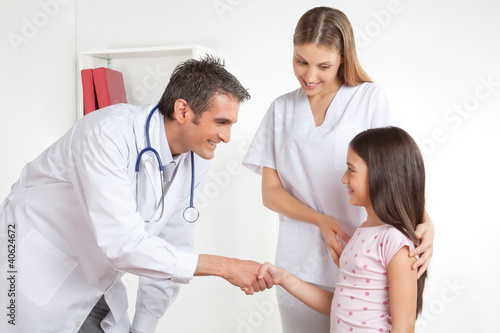 Photo: Doctor Congratulate Patient Doctor Congratulate Patient
