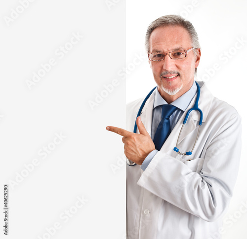 Photo: Doctor pointing a white board Doctor pointing a white board