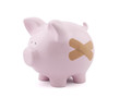 Piggy bank with plaster. Clipping path included. Piggy bank with plaster. Clipping path included.