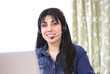 Photo: Pretty woman using Internet telephony Pretty woman using Internet telephony