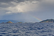 Rainbow at seascape with small islands