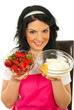 Woman prepare cake with strawberry