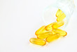 vitamins in glass on white background vitamins in glass on white background