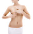 Woman examining her breast isolated on white background