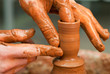 hands of a potter, creating an earthen jar on the circle hands of a potter, creating an earthen jar on the circle