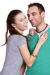Portrait of a beautiful young happy smiling couple - isolated