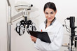Smiling Young Optometrist With Clipboard