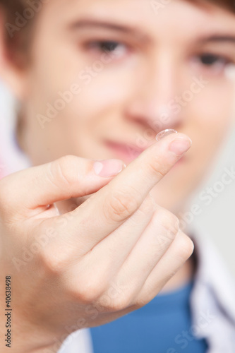 Photo: Optometrist Holding Contact Lens Optometrist Holding Contact Lens