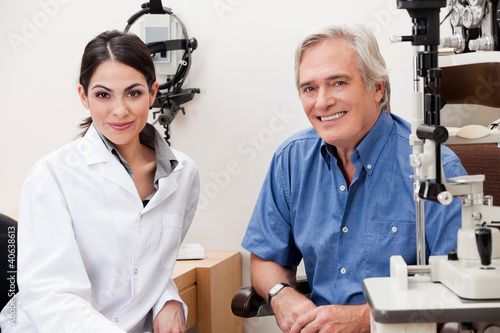 Photo: Smiling Optometrist With Her Patient Smiling Optometrist With Her Patient
