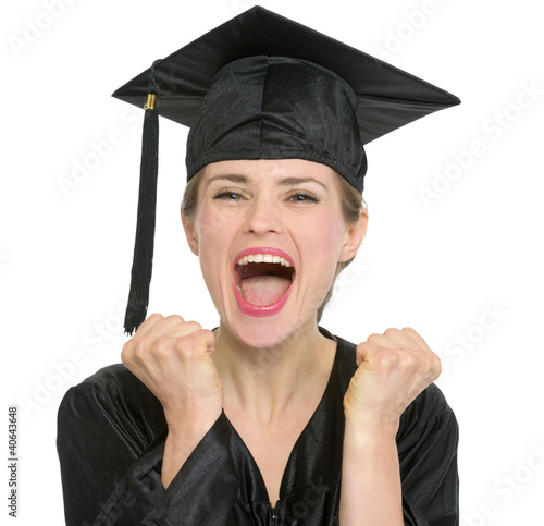 Photo: Portrait of excited graduation student woman isolated Portrait of excited graduation student woman isolated