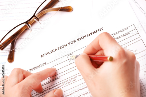 Photo: Completing an employment application Completing an employment application