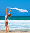 Dancing happy girl on the beach