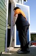 Disabled woman entering her house