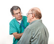 Doctor or Nurse Listens to Older Man's Heart and Lungs