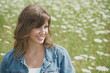 Smiling young Lady in Flower Field Smiling young Lady in Flower Field