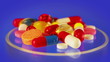 Pills and tablets heap rotating on blue, loop ready