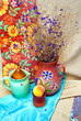 Still life with fruits and blue field flowers