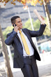 Businessman walking at the city park Businessman walking at the city park