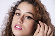 Woman applying the eyeliner