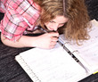 Young attractive girl is learning on the couch