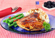 Barbecue chicken breast, string beans and potato salad garnished
