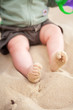 Photo: Baby feet covered in beach sand Baby feet covered in beach sand