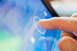 finger touching tablet device
