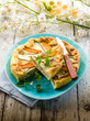canvas print picture - vegetables cake over dish on wood background