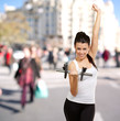 portrait of young woman doing fitness with weights at crowded st portrait of young woman doing fitness with weights at crowded st