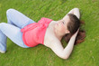 Woman laying on the grass