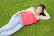 Woman laying on the grass