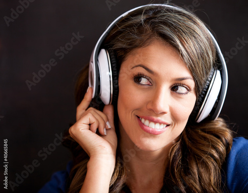Photo: Woman listening to music Woman listening to music