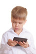 Photo: Reading boy with electronic book. Isolated Reading boy with electronic book. Isolated