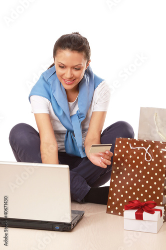 Photo: A woman shopping on-line A woman shopping on-line
