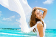 Photo: Beautiful Girl With White Scarf on The Beach Beautiful Girl With White Scarf on The Beach