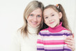 Generation: pretty caucasian mom hugging her little girl