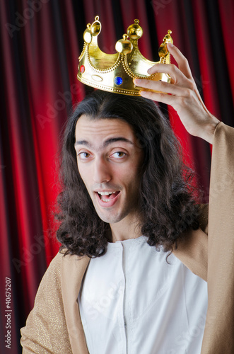 Photo: King with crown against background King with crown against background