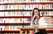 Portrait of a student  girl studying at library