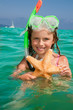 Snorkel girl with starfish in the sea Snorkel girl with starfish in the sea
