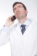 doctor talking on the phone and looking worried