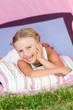 Lovely girl camping in tent