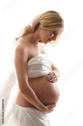 Photo: A young and happy blond pregnant Caucasian woman A young and happy blond pregnant Caucasian woman