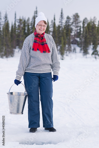 Photo: Woman and bucket Woman and bucket