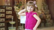 Close-up portrait of a little girl with the packages.