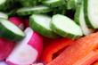 Vegetarian spring salad with cucumber, radish and pepper