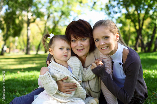 Photo: Family in summer park Family in summer park