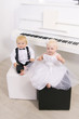 boy and girl in a suit sitting in a concert interior boy and girl in a suit sitting in a concert interior