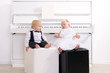 boy and girl in a suit sitting in a concert interior boy and girl in a suit sitting in a concert interior