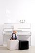 boy in a suit sitting reins white piano boy in a suit sitting reins white piano