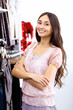 Young woman inside a store buying clothes